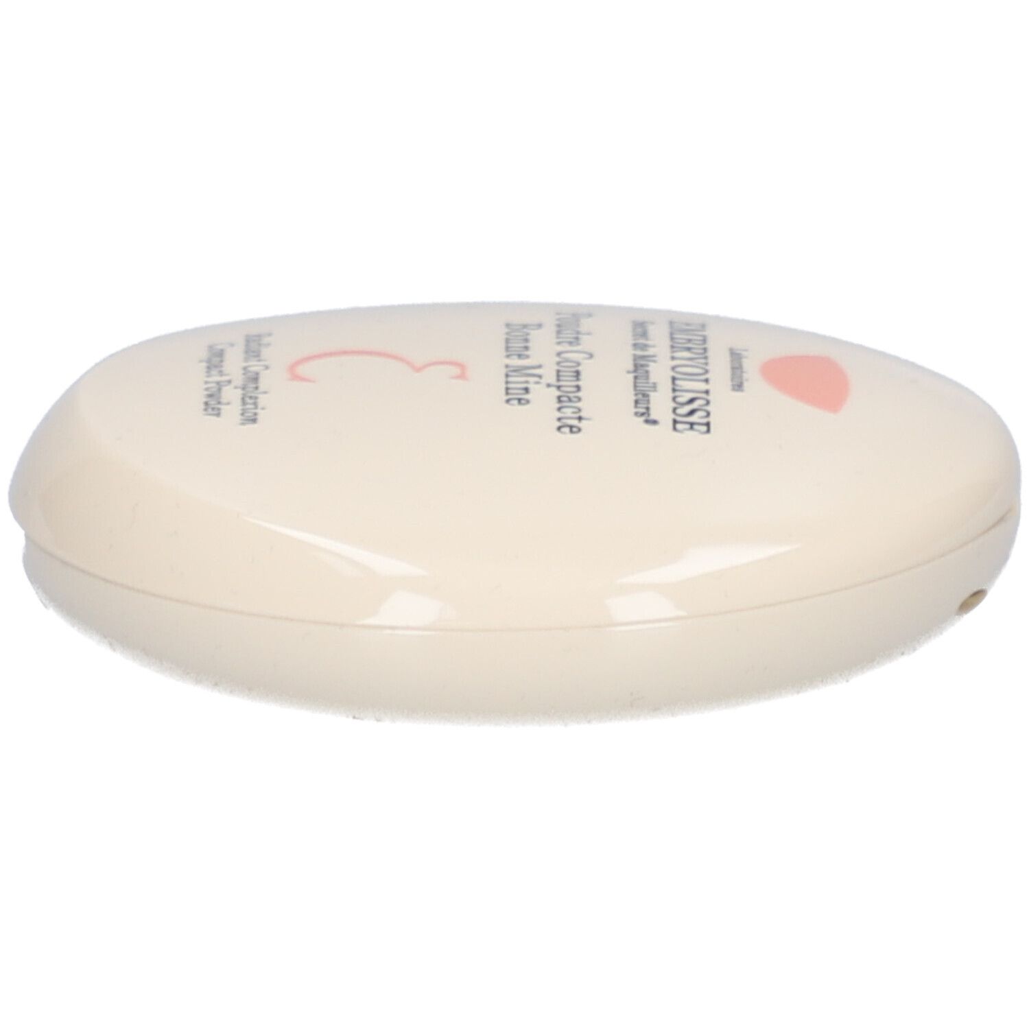 Ovale compactpoederdoos, crème. Opschrift: EMBRYOLISSE, Poudre Compacte Bonne Mine. Roze logo.