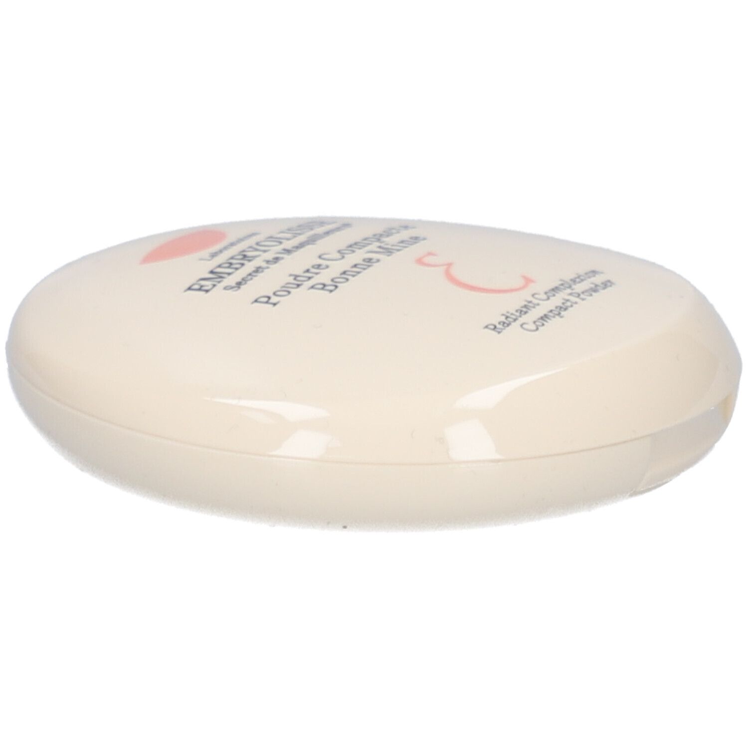 Ovale compactpoederdoos, crème. Opschrift: EMBRYOLISSE, Poudre Compacte Bonne Mine. Roze logo.