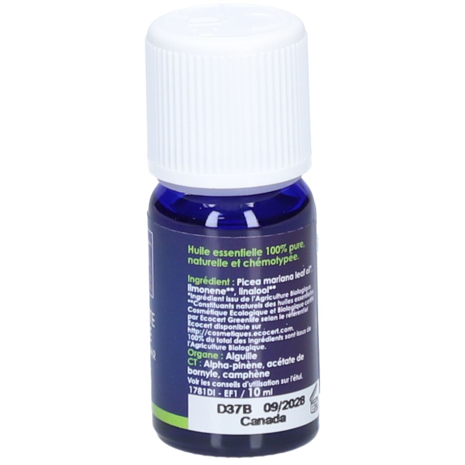 Donkerblauwe glazen fles met witte dop. Etiket met productinformatie, ingrediënten en certificeringen. Bio-keurmerk.