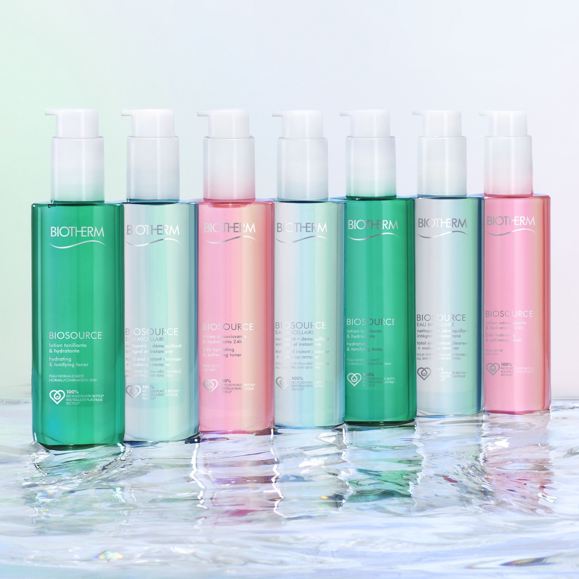 Rij flessen in verschillende kleuren. Opschrift: Biotherm Biosource. Met pomp.
