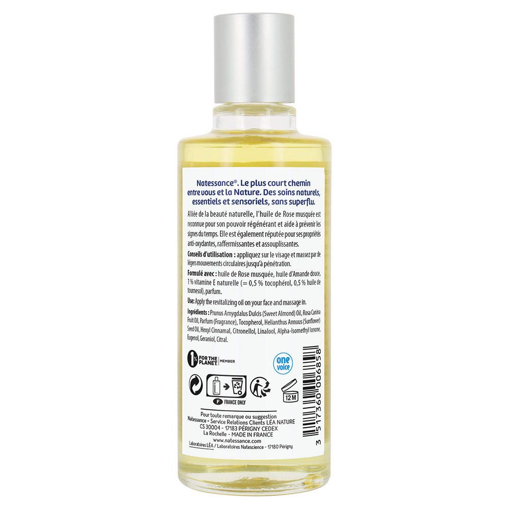 Achterkant van de Natessance rozenbottelolie fles. Tekst met ingrediënten, gebruiksaanwijzing en certificeringen.