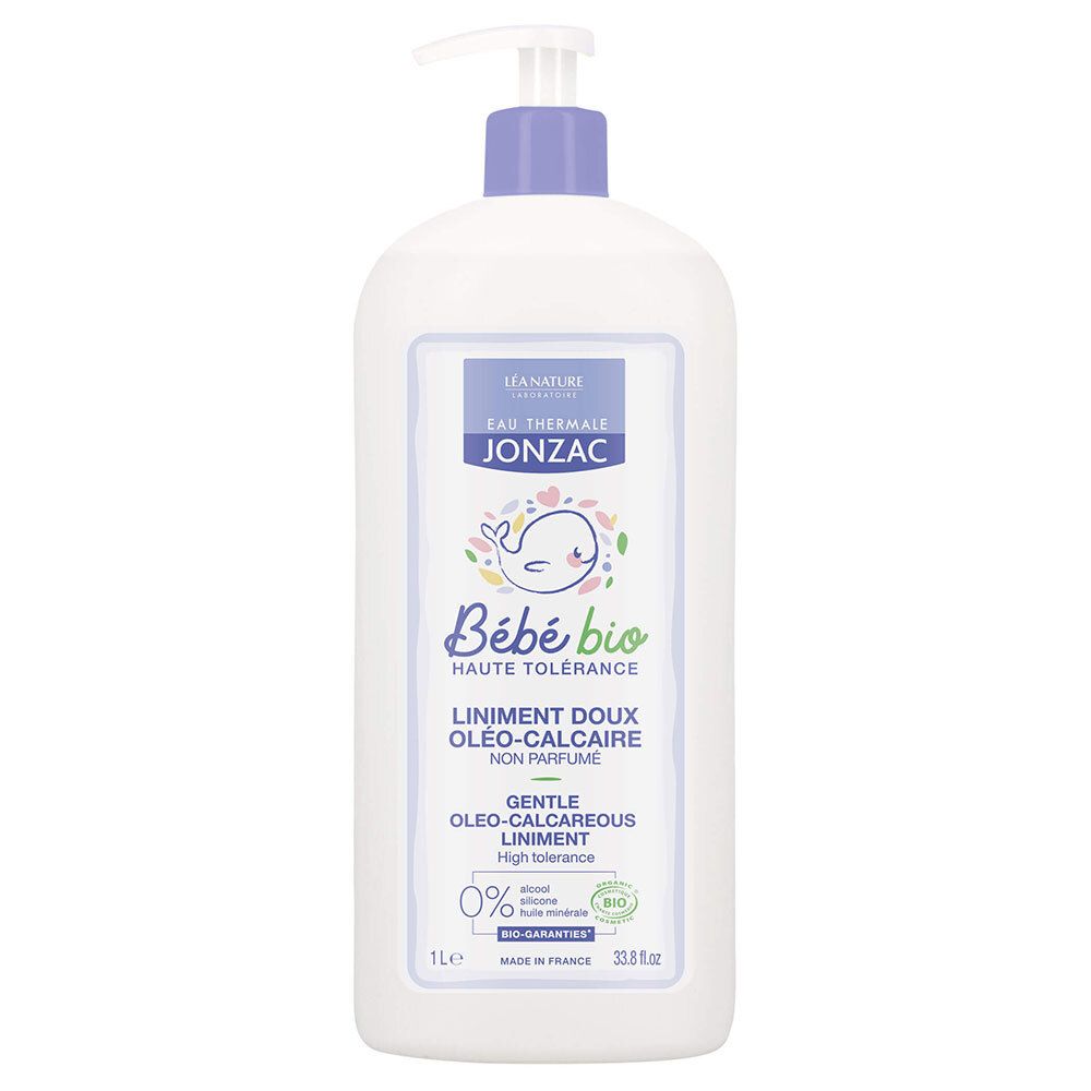 Witte fles met blauwe pomp. Etiket met productnaam en logo.