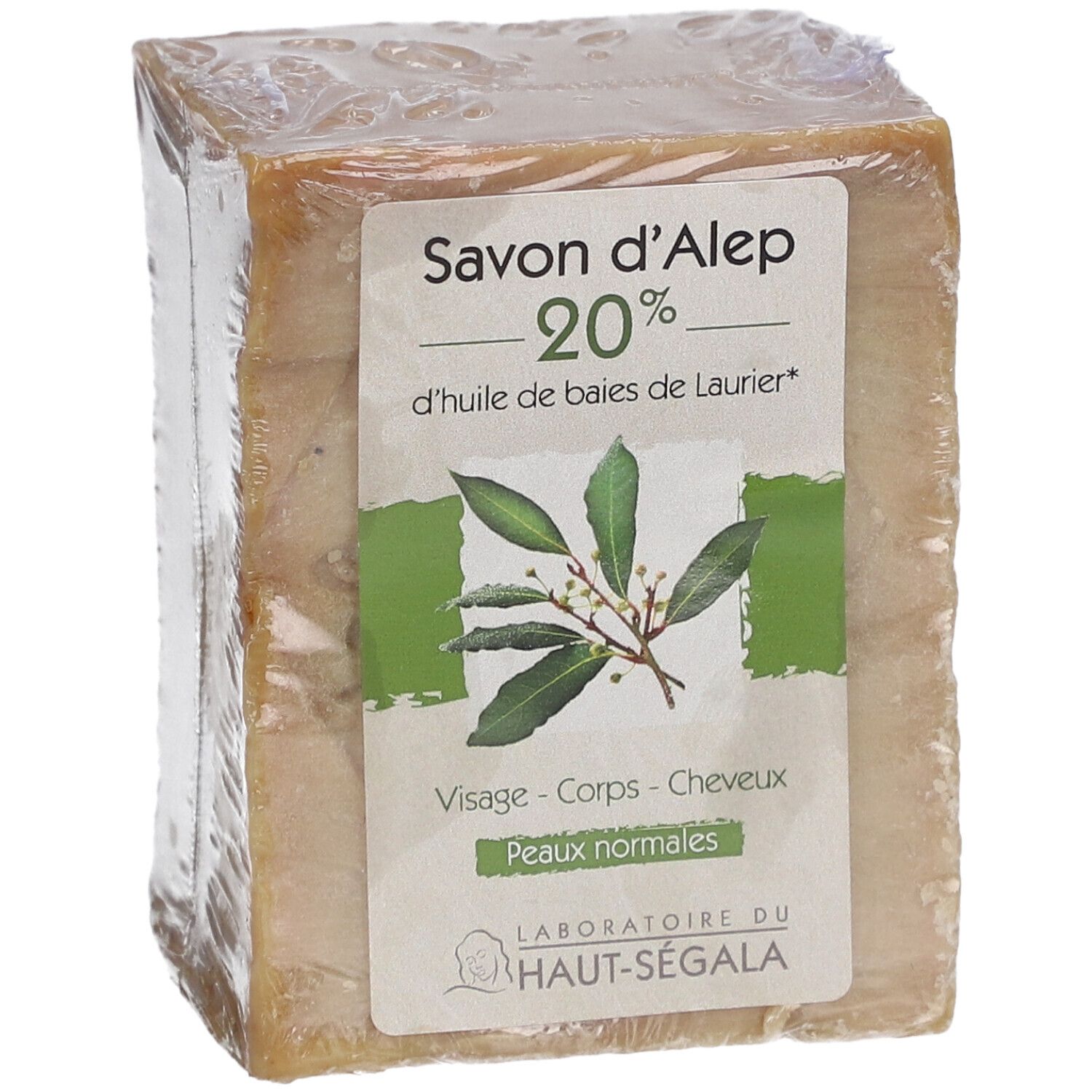 Kubusvormig zeepblok in folie. Etiket met productnaam, 20% laurierolie, bladeren en merk Laboratoire du Haut-Ségala.