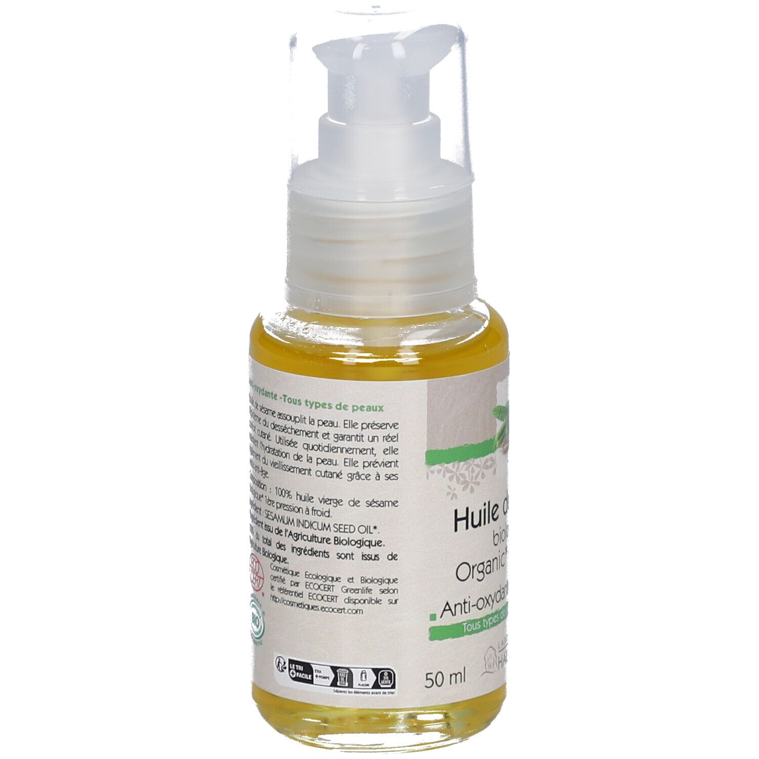 Fles sesamolie met pomp. Opschrift: Huile de sésame biologique, Anti-oxydante, Tous types de peaux. Tekst op achterkant.