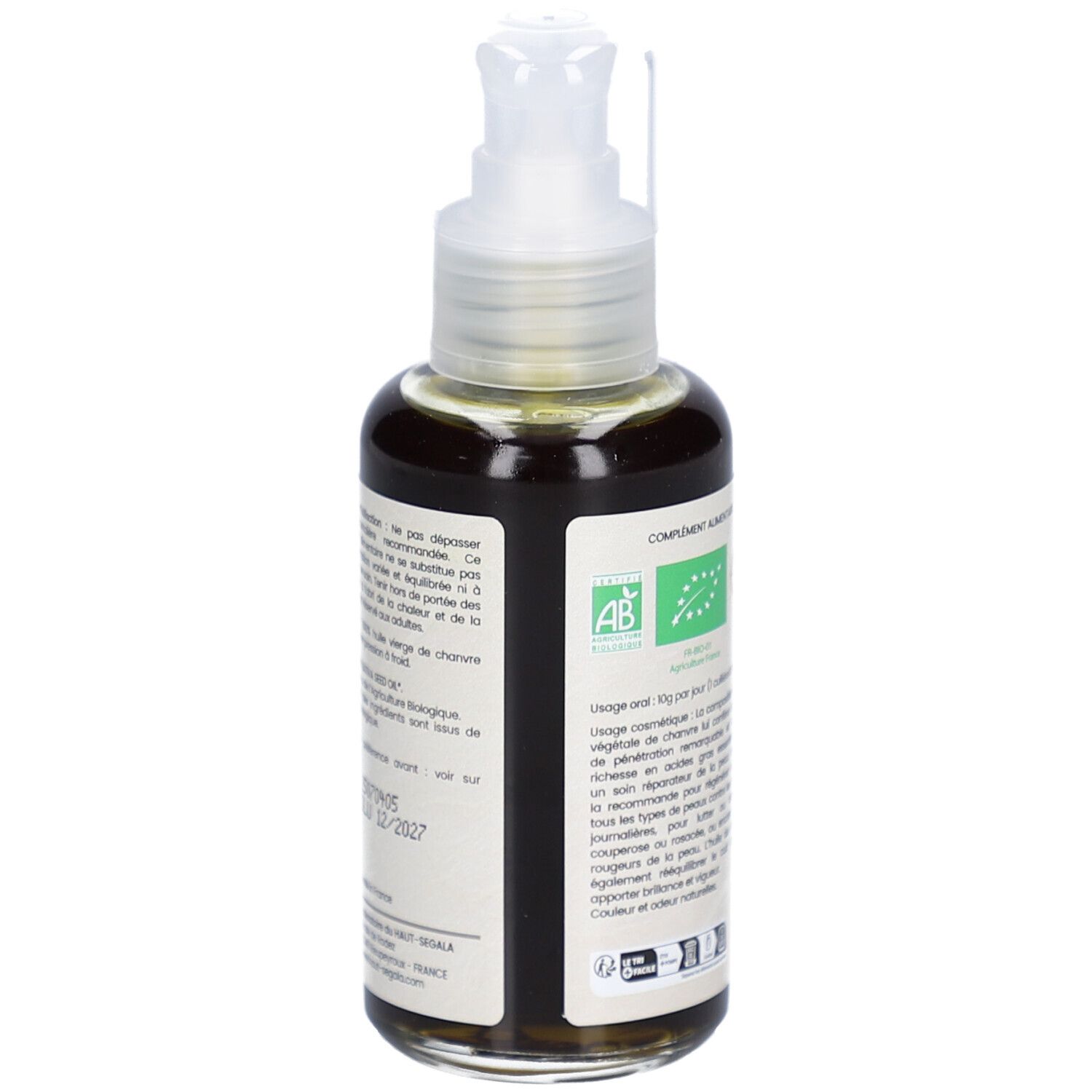 Achterkant van de bruine glazen fles met pomp. Etiket met tekst en biologische labels. Merk: HAUT-SEGALA.