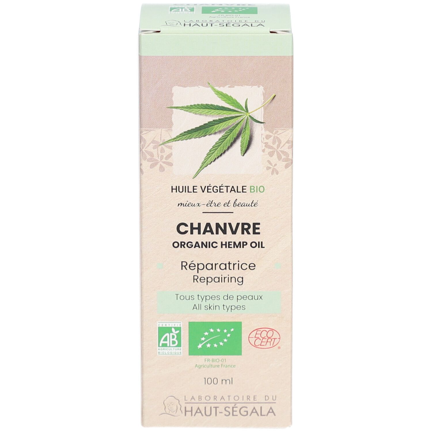 Kartonnen verpakking. Tekst: Huile Végétale Bio, Chanvre, Organic Hemp Oil. Hennepblad illustratie. Biologische labels. Merk: HAUT-SEGALA.