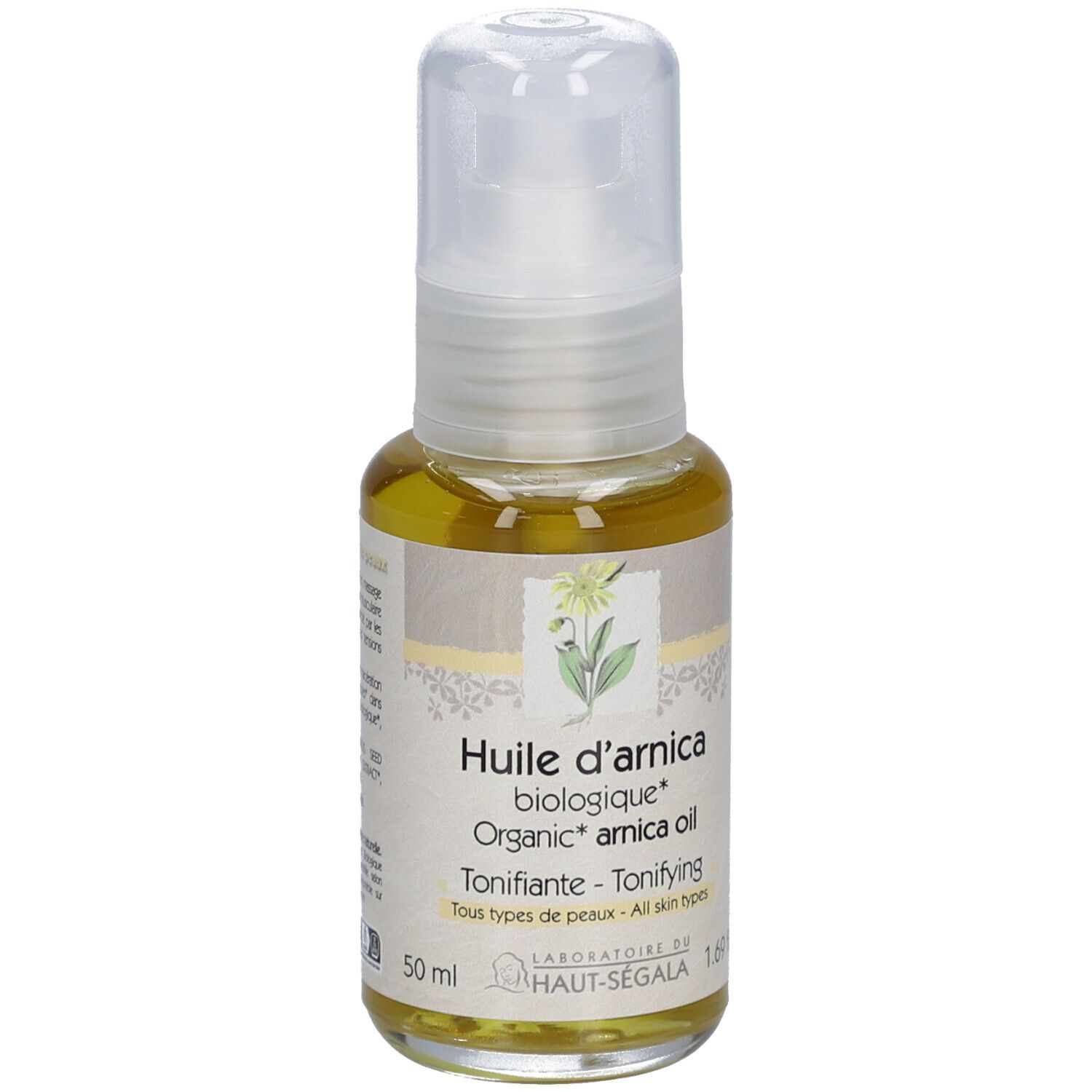 Arnica-oliefles. Gele olie in een glazen fles met verstuiver. Productinformatie op het etiket.