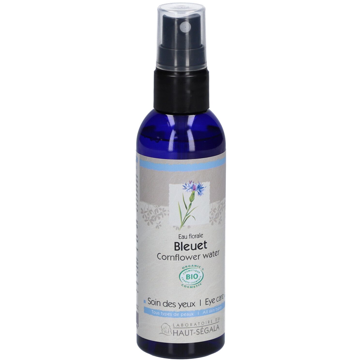Blauwe fles met verstuiver. Opschrift: Eau florale Bleuet Cornflower water. Bio-certificering. Laboratoire du Haut-Ségala.