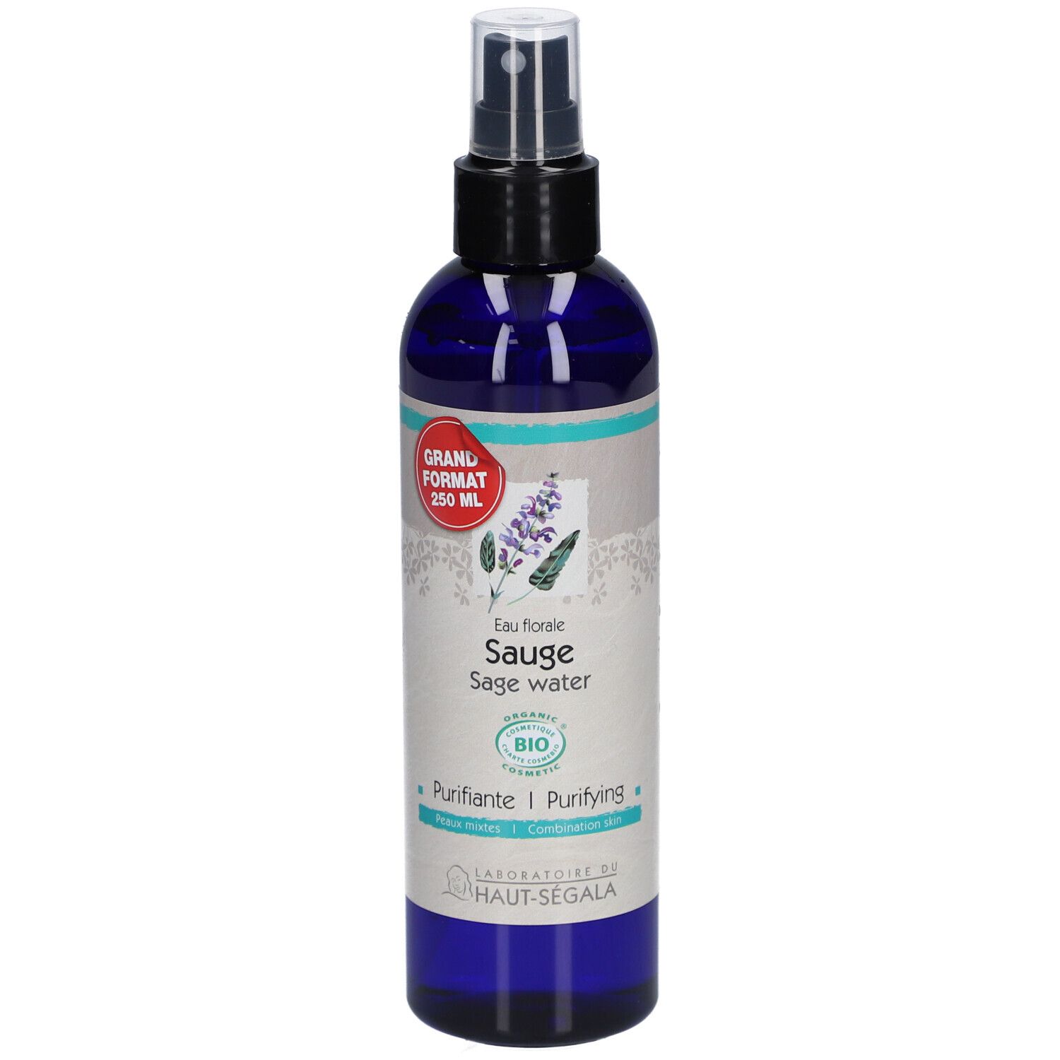 Flacon bleu transparent avec vaporisateur noir. Étiquette avec nom du produit, label bio et autocollant rouge.