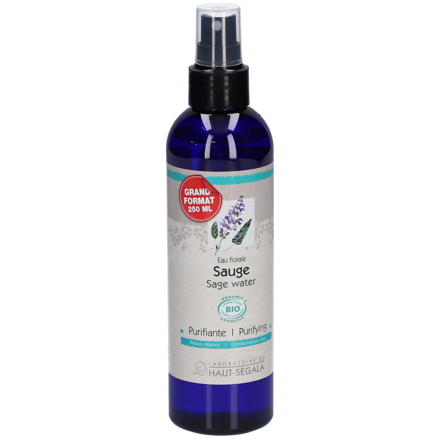 Flacon bleu transparent avec vaporisateur noir. Étiquette avec nom du produit, label bio et autocollant rouge.