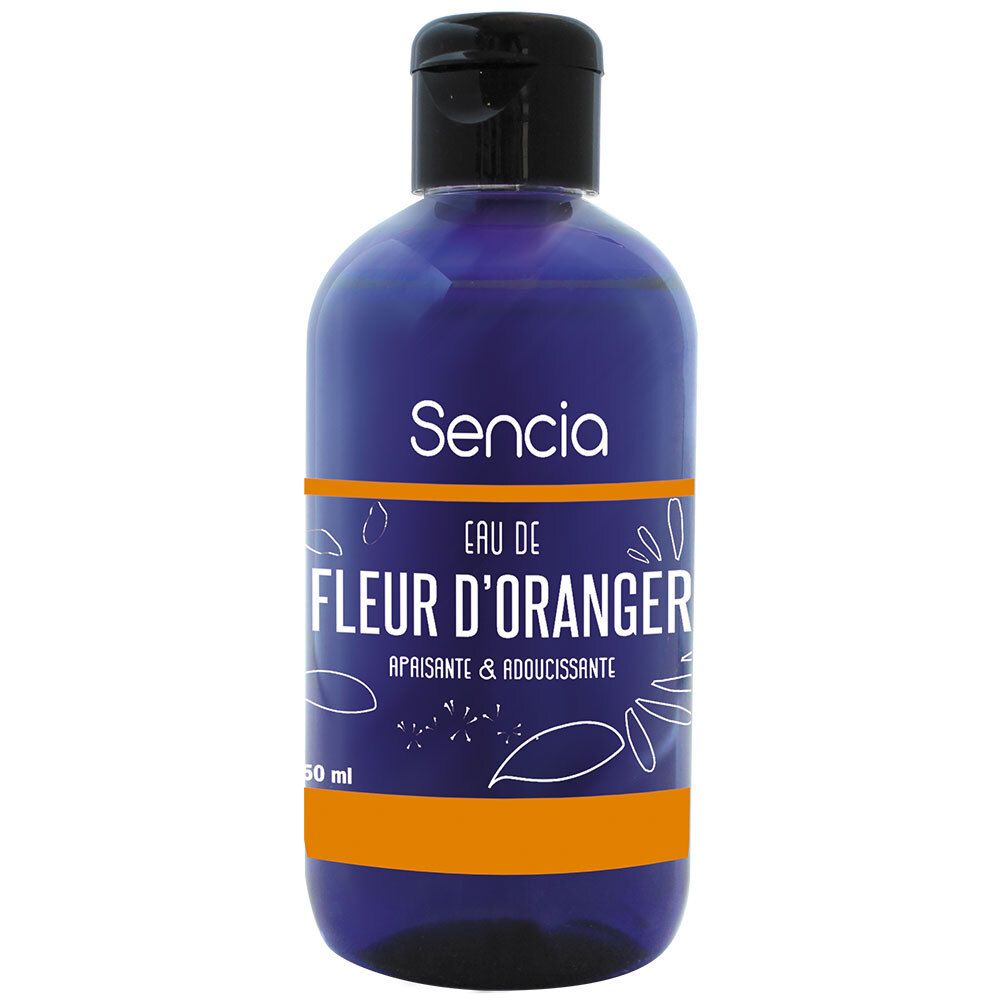 Blauwe fles met zwarte dop. Opschrift: Sencia, Eau de Fleur d'Oranger, Apaisante & Adoucissante. Oranje streep.