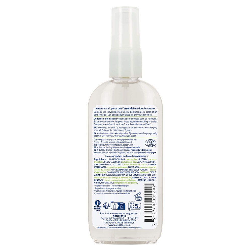 Achterkant van de fles. Tekst met ingrediënten en instructies. Biologische certificering. Transparante vloeistof zichtbaar.