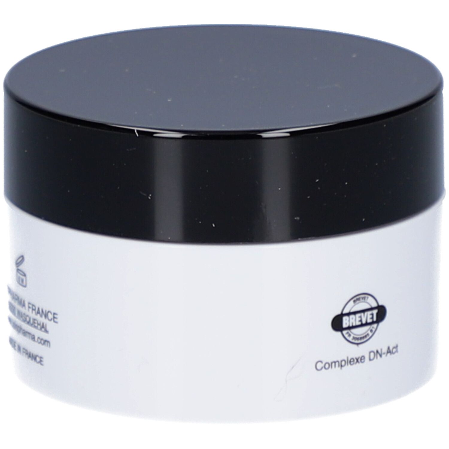 Crèmepot met zwarte deksel. Opschrift: ISISPHARMA, BREVET, Complexe DN-Act.
