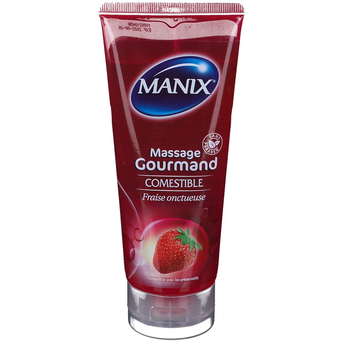 Tube rouge MANIX. Texte: Massage Gourmand comestible, Fraise onctueuse. Fraise. Bouchon transparent.