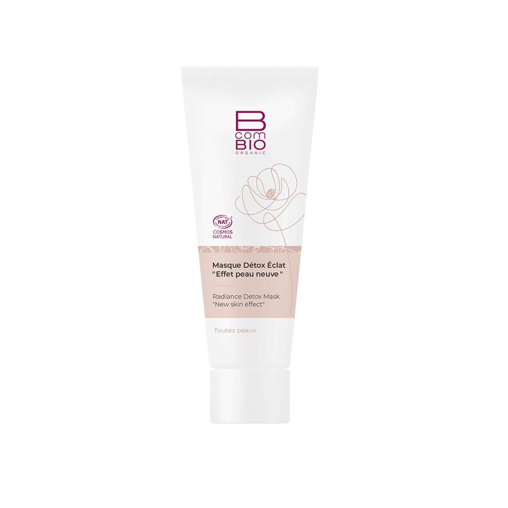 Tube blanc avec impression rose. Contient B COM BIO ORGANIC, Masque Détox Éclat, « Effet peau neuve ». Certification COSMOS NATURAL.