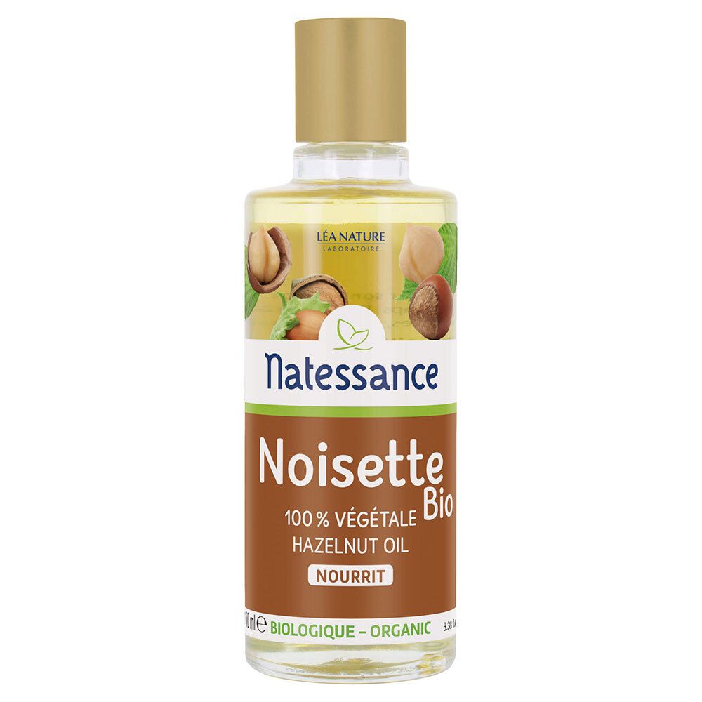 Glazen fles met gouden dop. Etiket met "Natessance Noisette Bio" en hazelnoot illustraties. 100% plantaardige hazelnootolie.