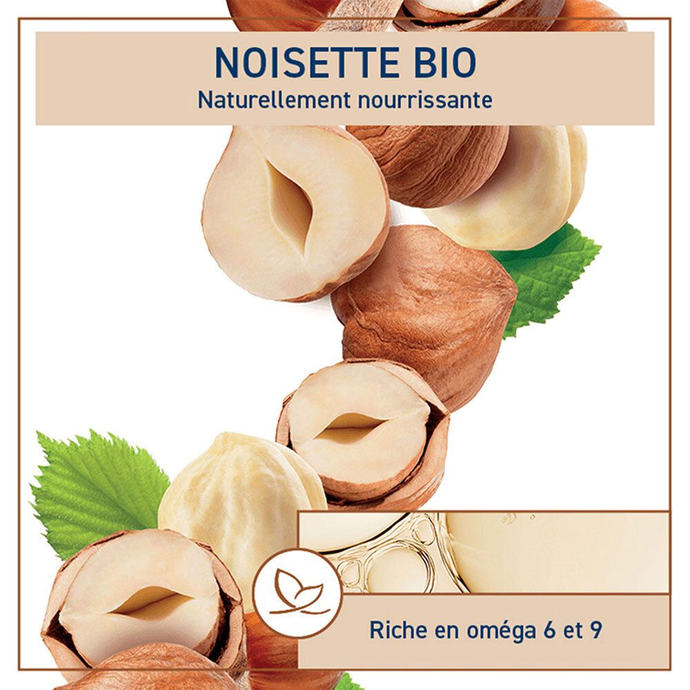 Close-up van hazelnoten en bladeren. Tekst: Noisette Bio, natuurlijk voedend, rijk aan omega 6 en 9.