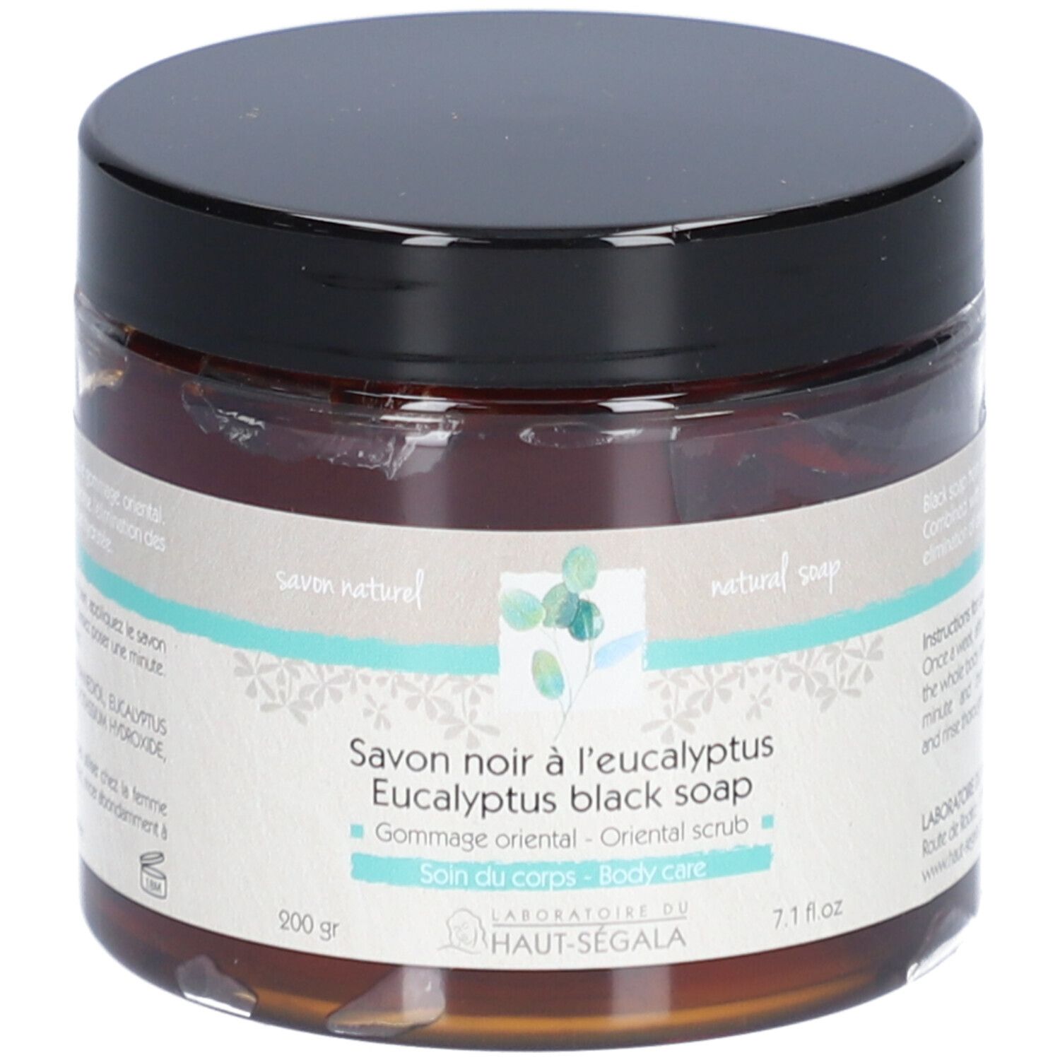 Bruine glazen pot met zwarte deksel. Opschrift: Savon noir à l'eucalyptus, Eucalyptus black soap, Gommage oriental, Soin du corps.