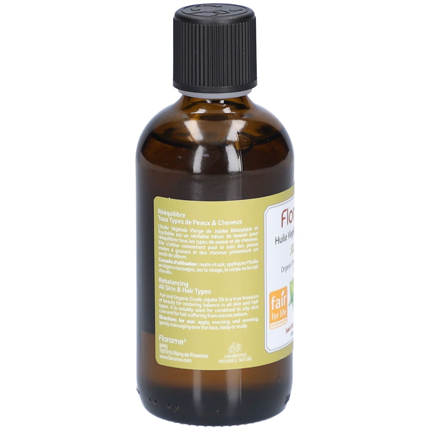 Dos d'une bouteille en verre brun avec bouchon noir. Étiquette avec texte et logos. Label Fair for Life et certification bio.
