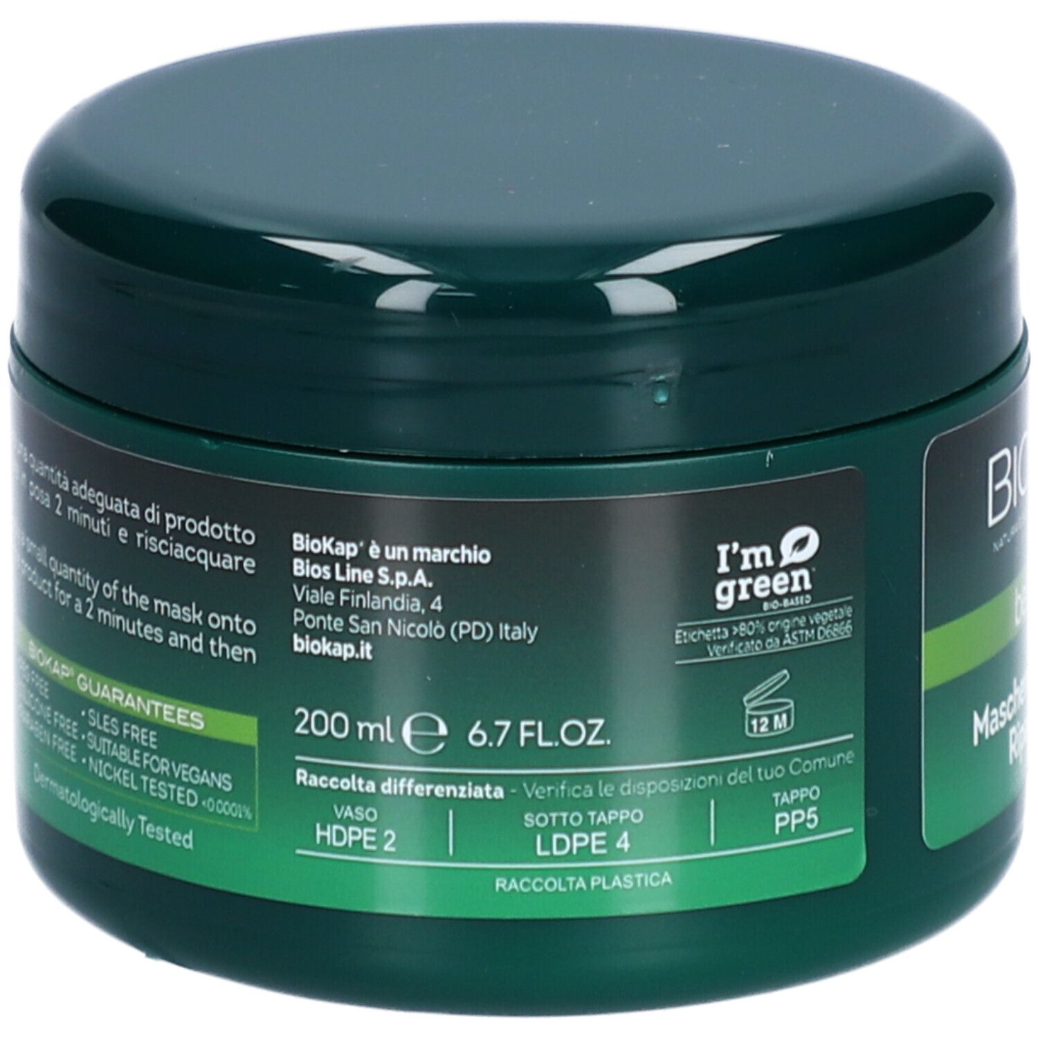Groene pot met tekst. Opschrift: BIOKAP. Bevat haarmasker. Tekst: 200 ml 6.7 FL.OZ. en productie-informatie.
