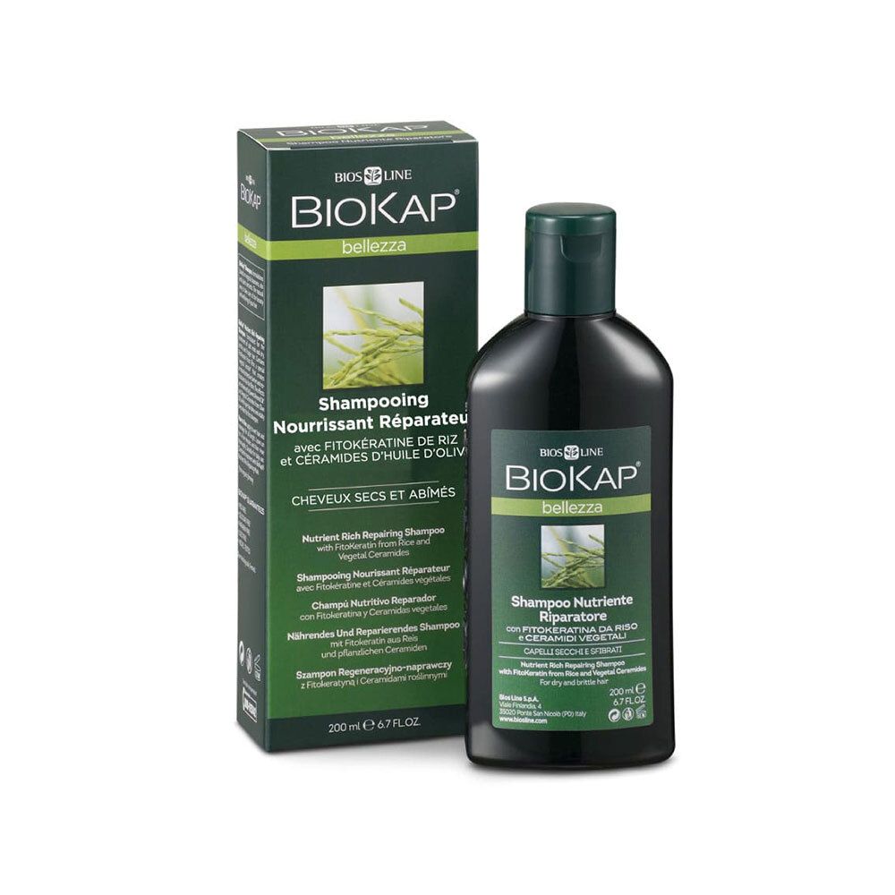 Groene fles en doos shampoo. Opschrift BIOKAP, Shampoo Nourrissant Réparateur. Voor droog en beschadigd haar.