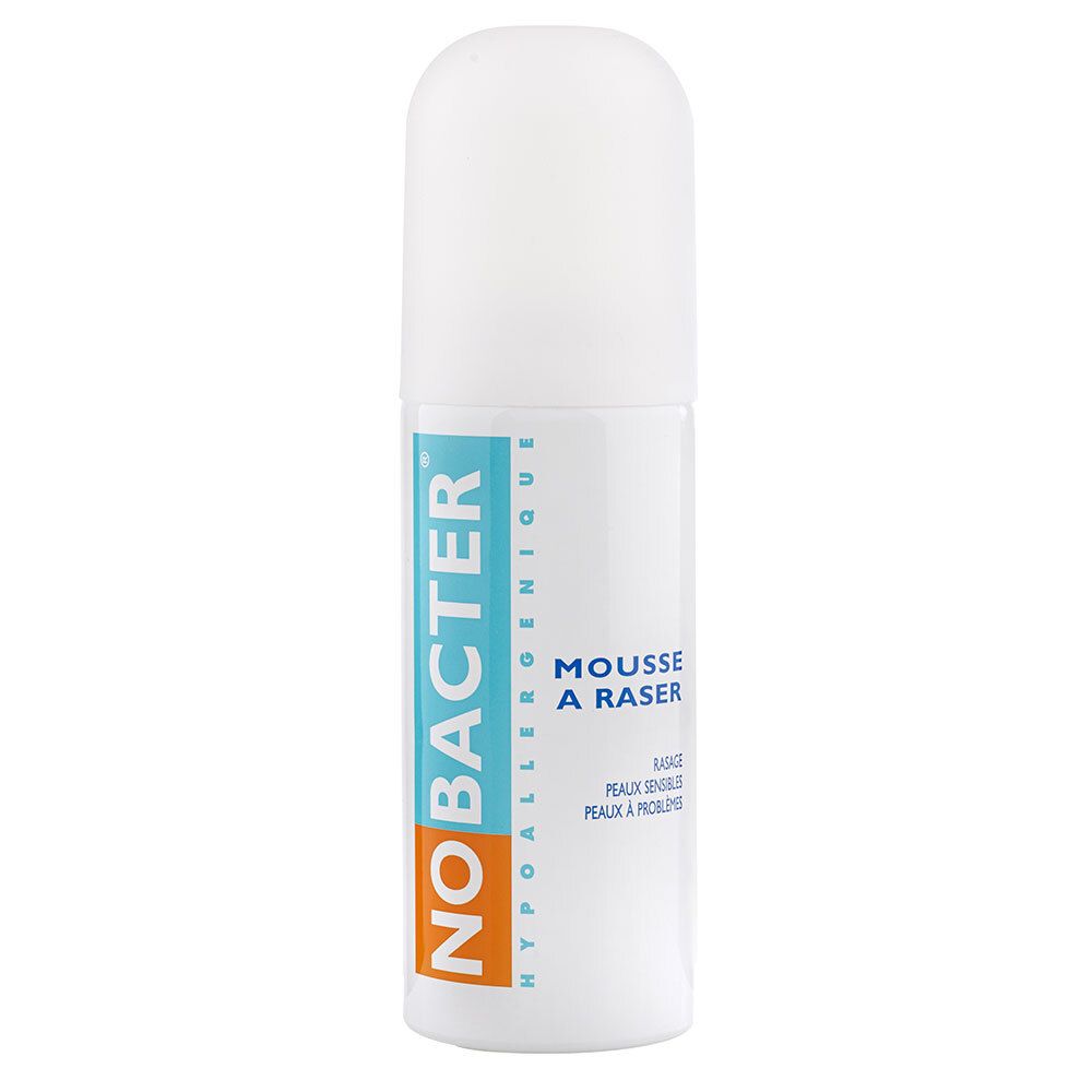 Wit cilindrisch product met blauw-rode tekst. NO BACTER, MOUSSE A RASER, Hypoallergenique. Voor gevoelige huid.