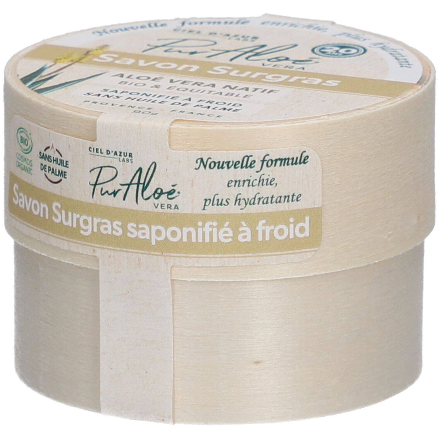 Ronde doos met "Savon Surgras". Label "PurAloé" en bio-logo. Tekst: "Nouvelle formule, enrichie, plus hydratante".