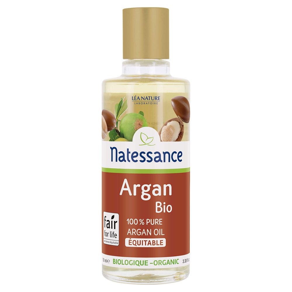 Flacon d'huile d'argan avec bouchon doré. Inscription: Natessance Argan Bio, 100% huile d'argan pure. Label Fair for Life.