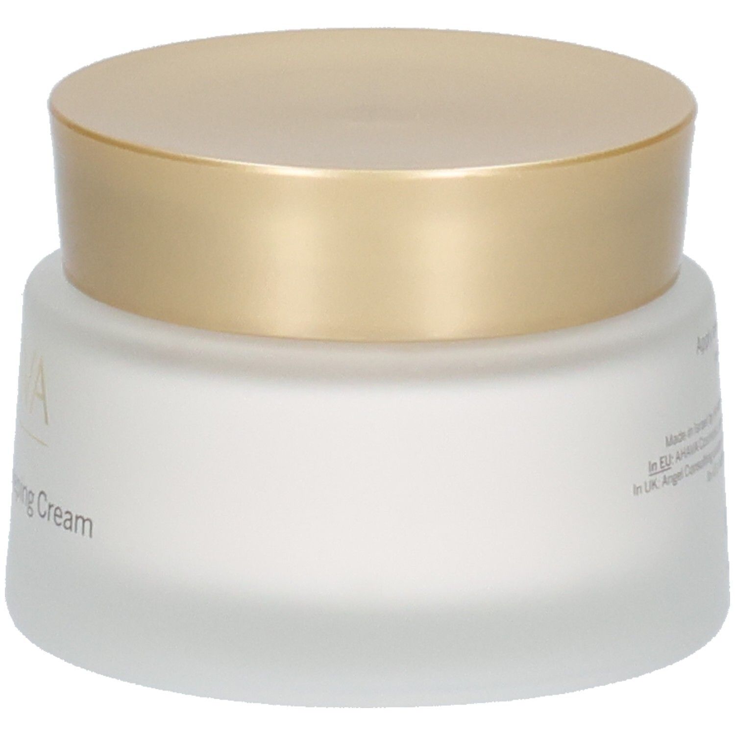 Crèmepot met gouden deksel. Opschrift AHAVA en Brightening Sleeping Cream. Wit, mat glas.