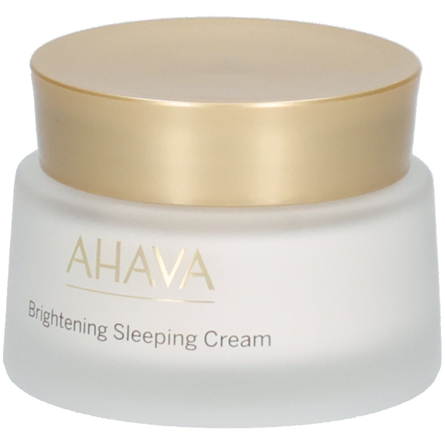 Crèmepot met gouden deksel. Opschrift AHAVA en Brightening Sleeping Cream. Wit, mat glas.