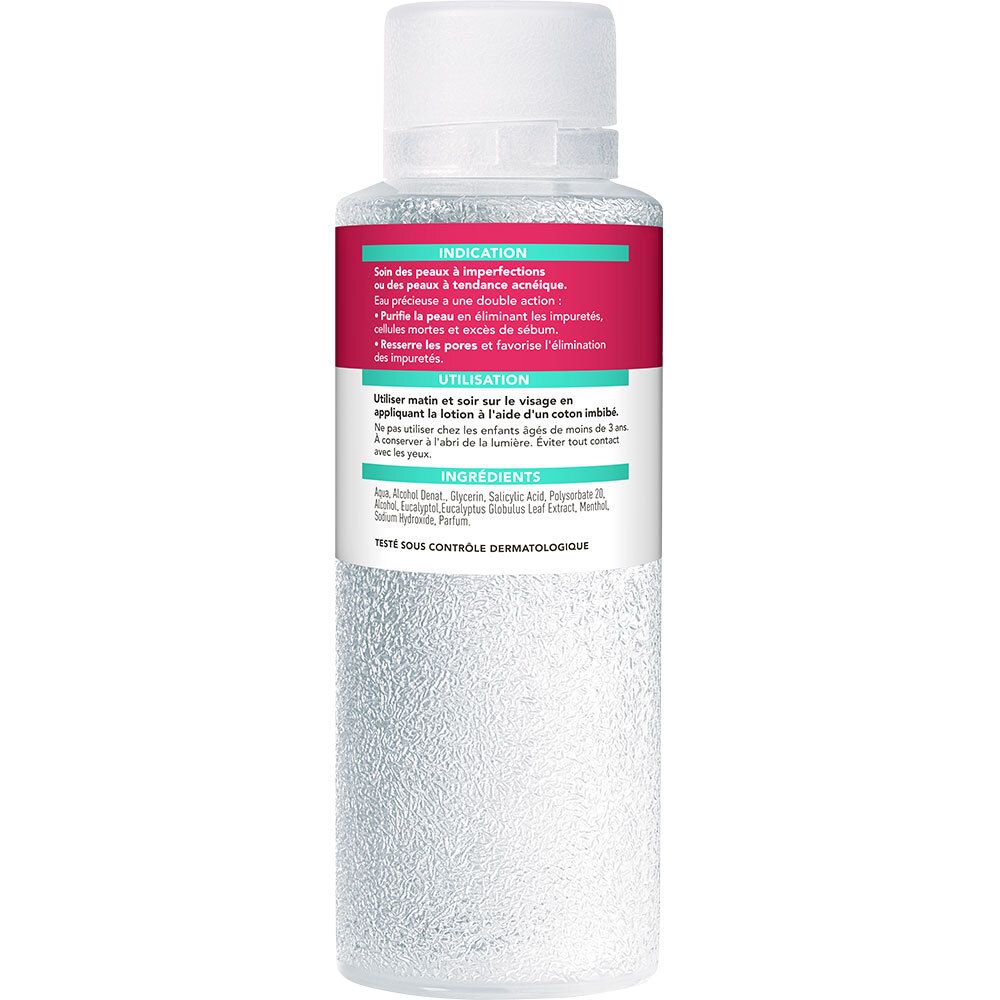 Achterkant van de fles. Etiket met tekst: Indicatie, Gebruik, Ingrediënten. Dermatologisch getest.