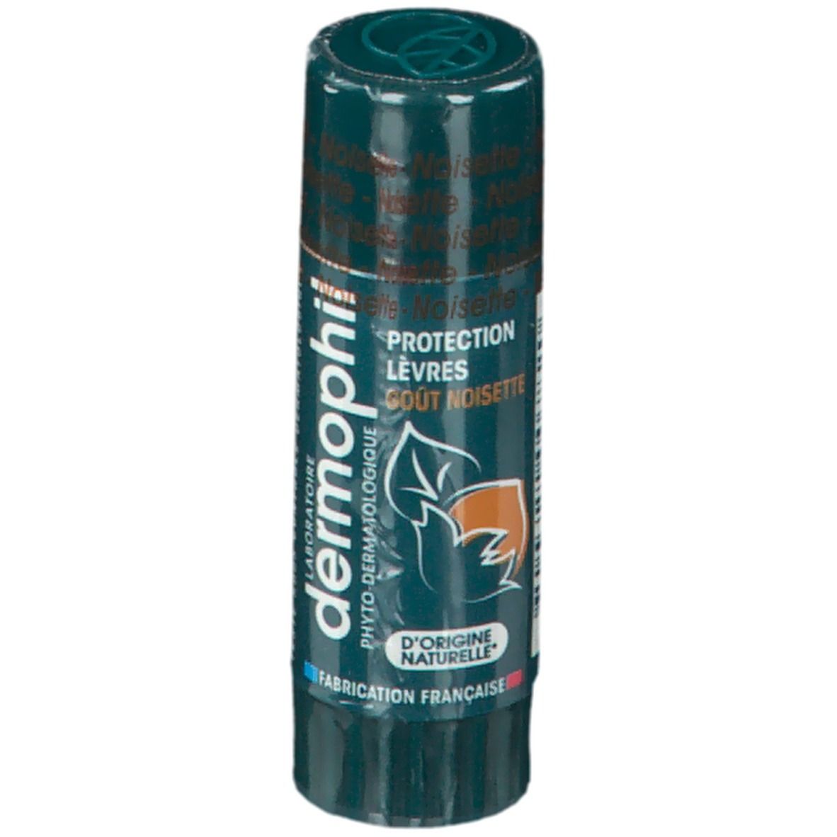 Stick protecteur pour les lèvres Dermophil. Emballage vert. Inscription: Protection Lèvres, Gout Noisette. Logo: feuille et noix. Fabriqué en France.