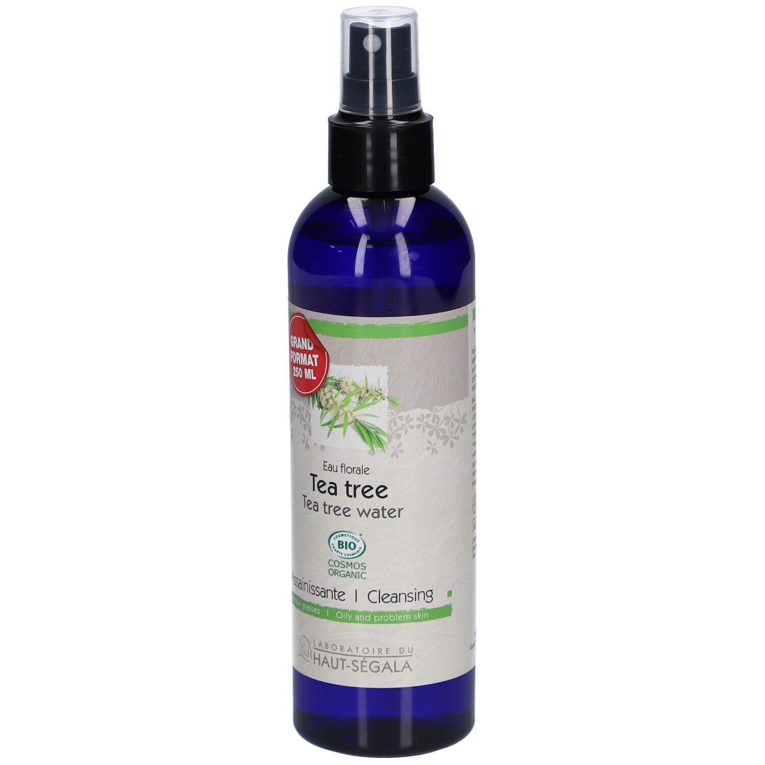 Flacon bleu avec vaporisateur. Étiquette : Eau florale de tea tree. Certification bio. Grand format.