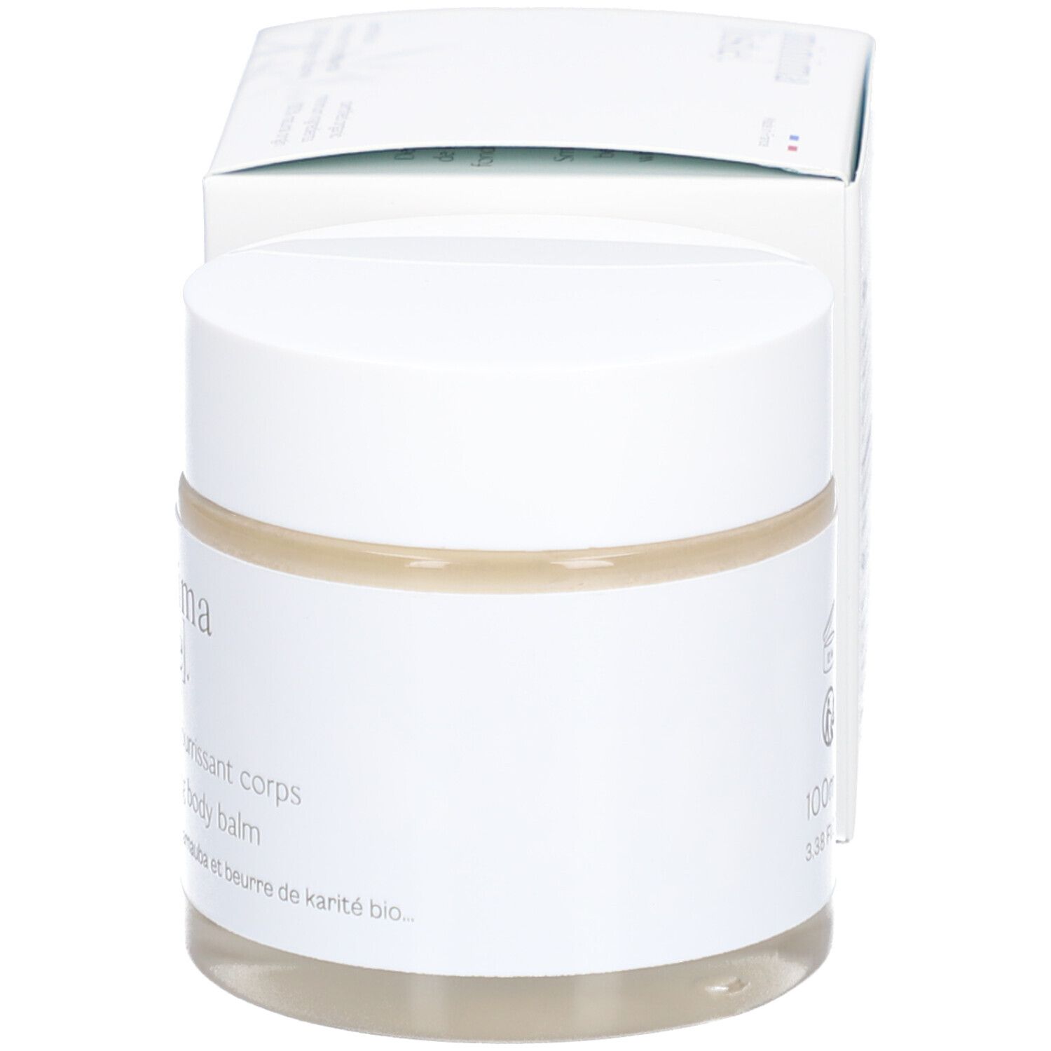 Pot avec couvercle blanc et carton. Inscription: minima[liste]. Baume nourrissant corps. 100ml. Angle de vue.