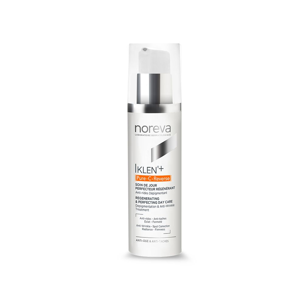 Witte fles met zilveren pomp. Opschrift: noreva, Iklen+ [Pure-C-Reverse], Regenererende dagverzorging.
