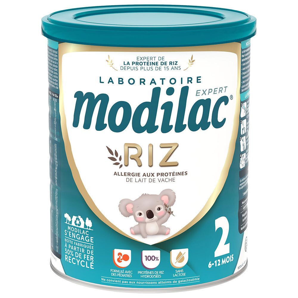 Ronde blauwe bus. Opschrift: Modilac Expert Riz, allergie aux protéines de lait de vache. Voor 6-12 maanden.