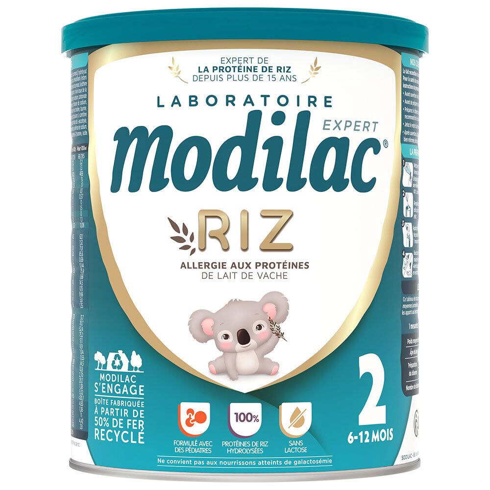 Ronde blauwe bus. Opschrift: Modilac Expert Riz, allergie aux protéines de lait de vache. Voor 6-12 maanden.