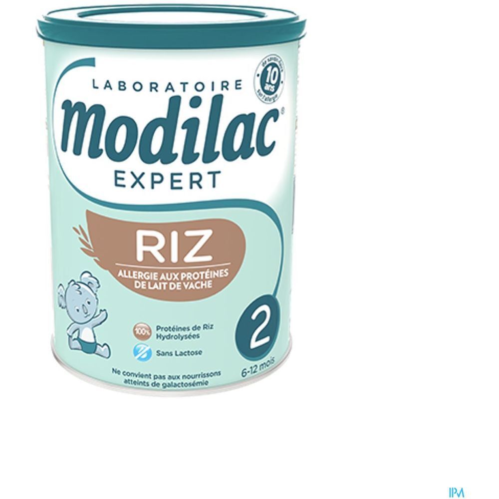 Ronde blauwe bus. Opschrift: Modilac Expert Riz, allergie aux protéines de lait de vache. Voor 6-12 maanden.