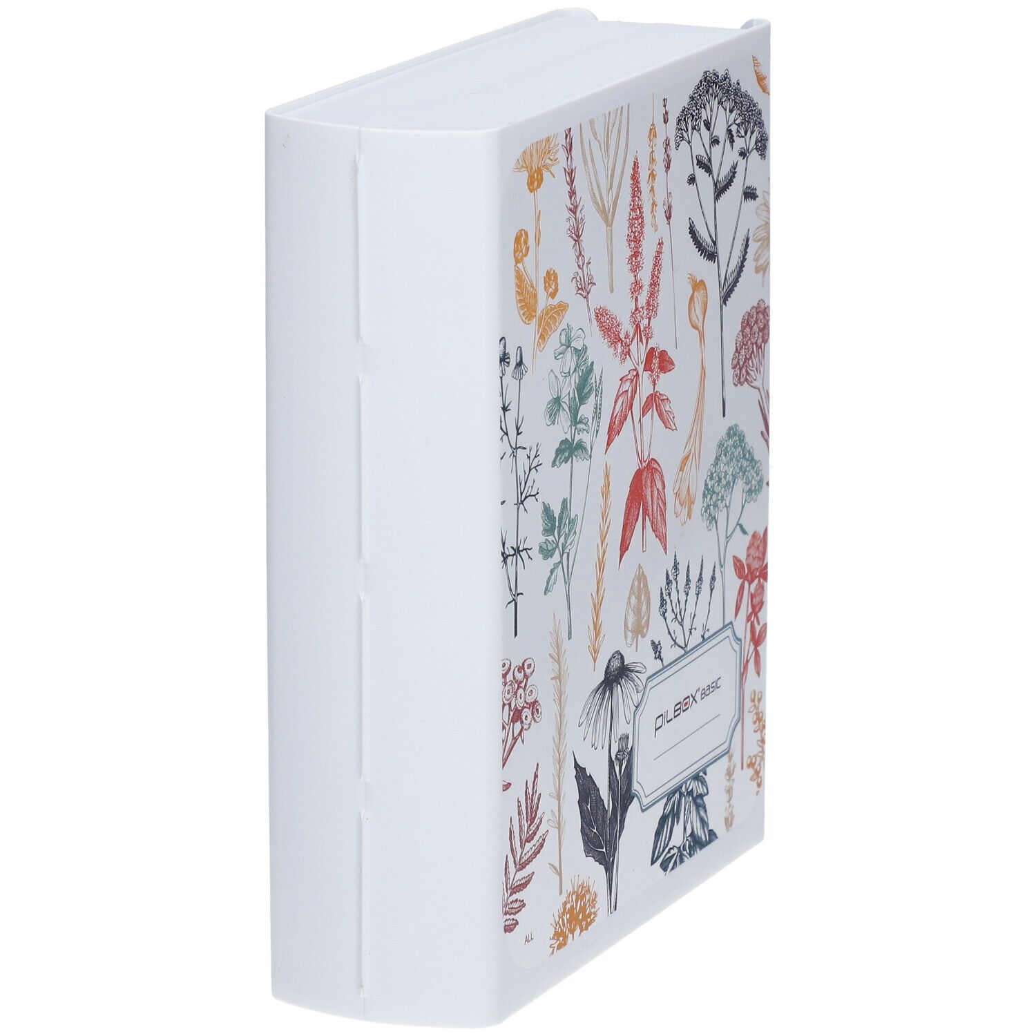 Pilulier en forme de livre, blanc avec motif floral. Inscription "PILBOX basic".