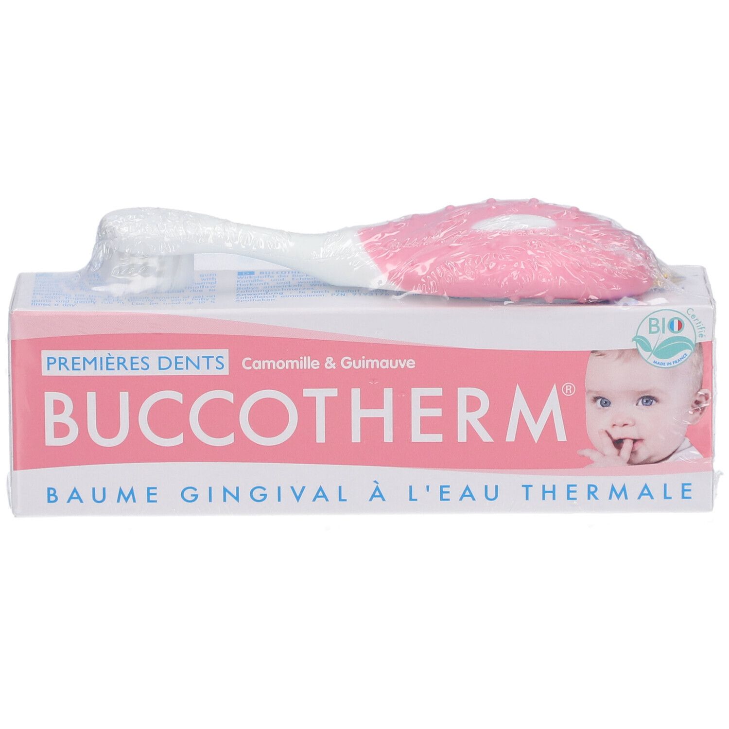 Emballage avec brosse à dents. Inscription: Buccotherm, Premières Dents, Baume Gingival à l'Eau Thermale. Label Bio.