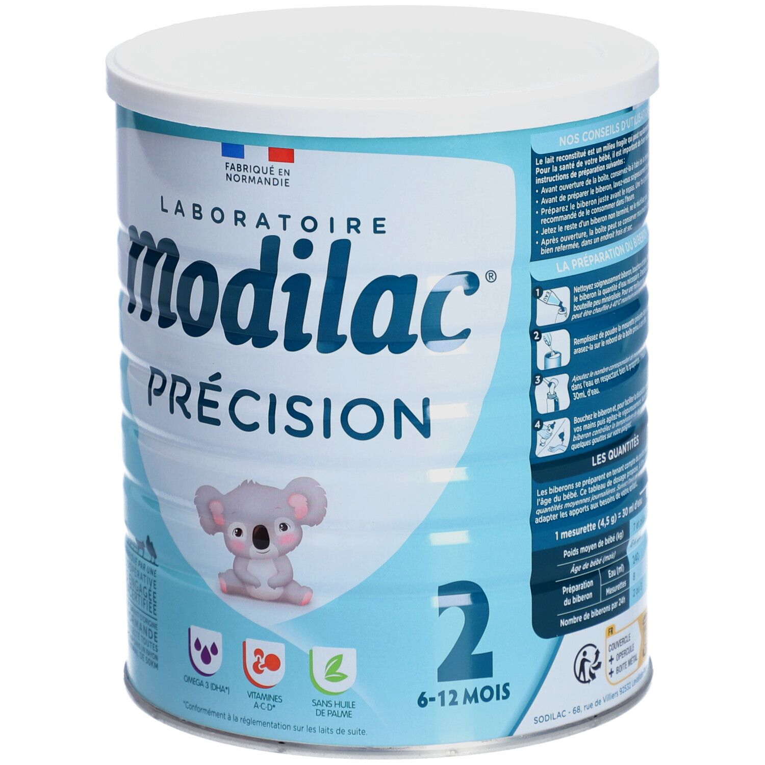 Lichtblauwe bus met witte deksel. Opschrift: Modilac Précision, 2, 6-12 maanden. Koala-illustratie. Instructies.