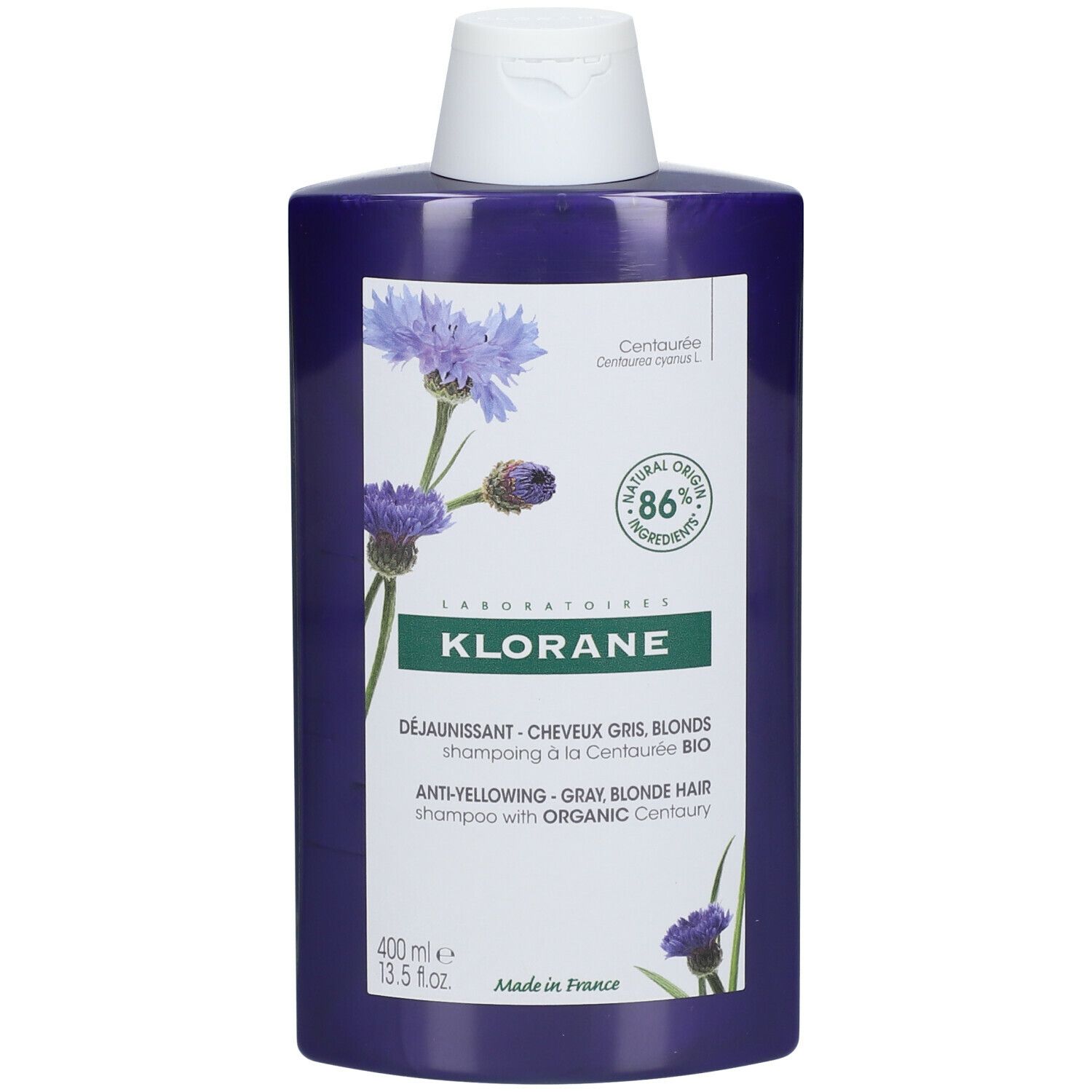 Paarse shampoo fles met witte dop. Opschrift: KLORANE, anti-geel shampoo voor grijs en blond haar met biologische Centaurie.