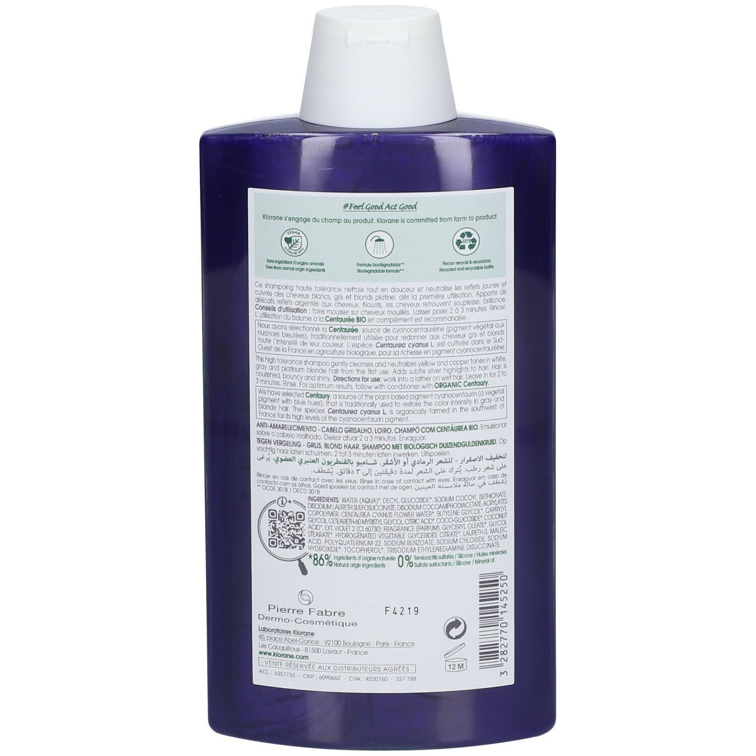 Achterkant van de paarse shampoo fles. Tekst met ingrediënten, gebruiksaanwijzing en recycling symbolen. QR-code en fabrikant informatie.