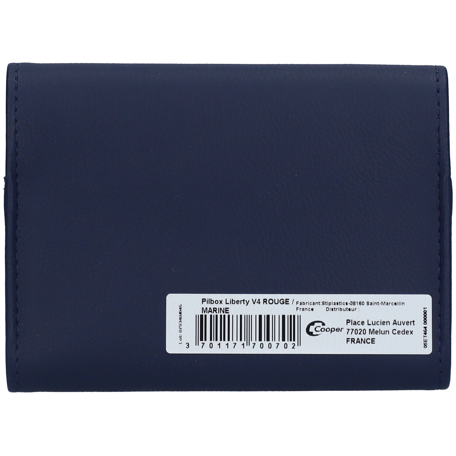 Dos du pilulier bleu foncé. Autocollant avec informations produit et code-barres.