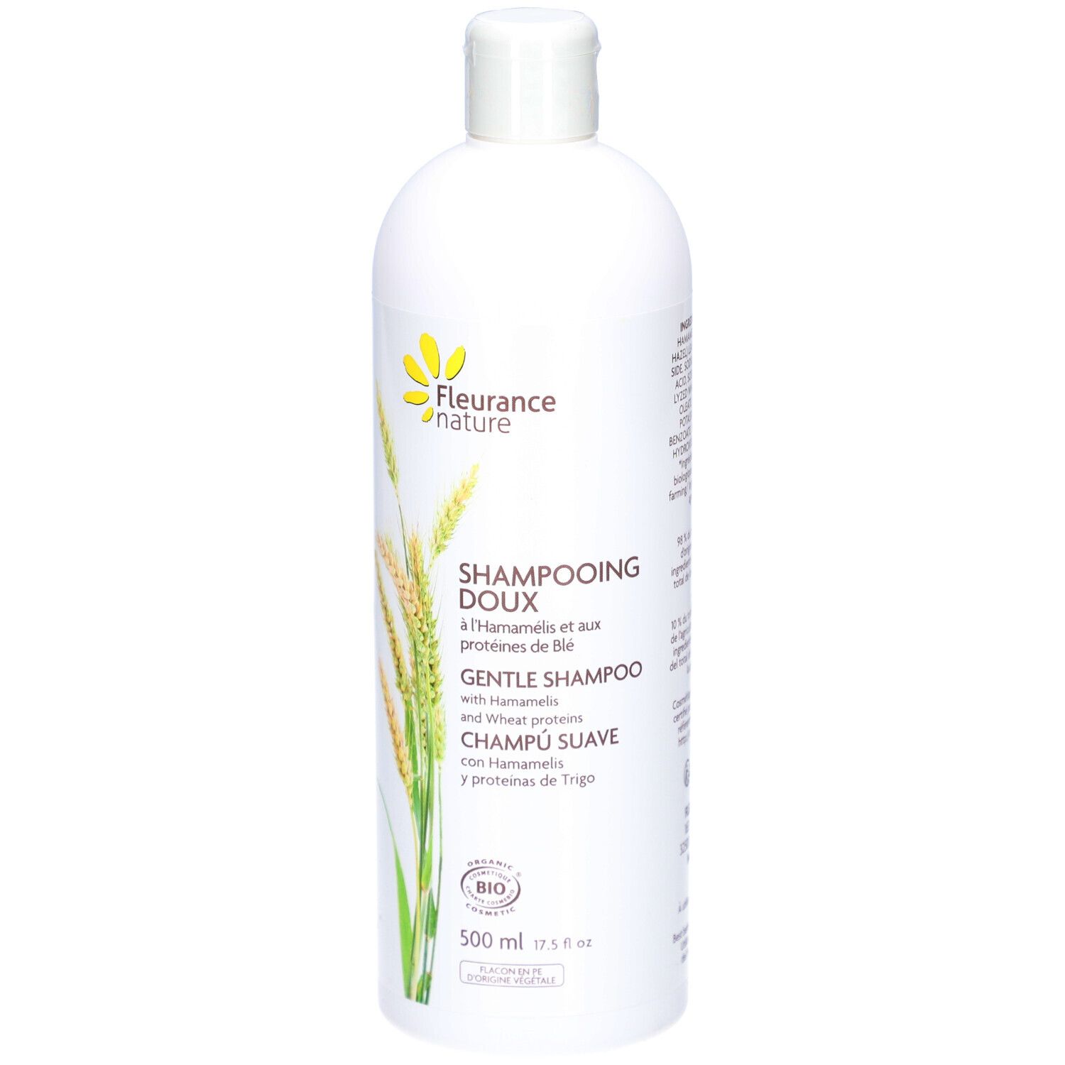 Witte shampoo fles. Label: DOUX, HAMAMELIS, tarweproteïnen. Bio-certificering. 500 ml.
