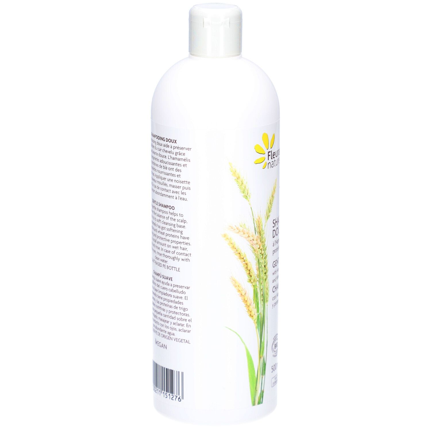 Achterkant van de witte shampoo fles. Tekst: DOUX, HAMAMELIS, tarweproteïnen. Vegan. Ingrediënten.