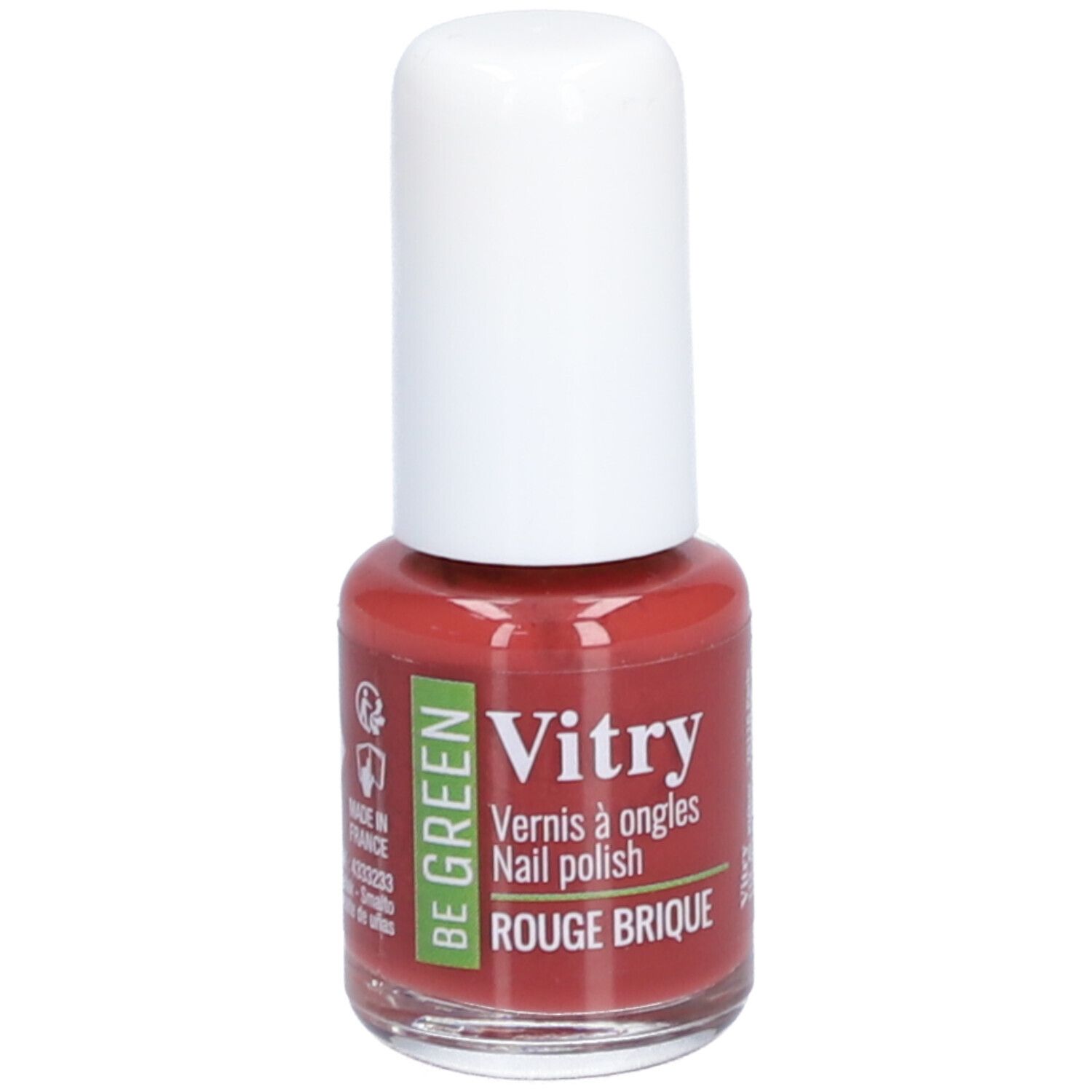 Nagellakflesje met witte dop. Opschrift: Vitry, BE GREEN, Rouge Brique. Rode nagellak.