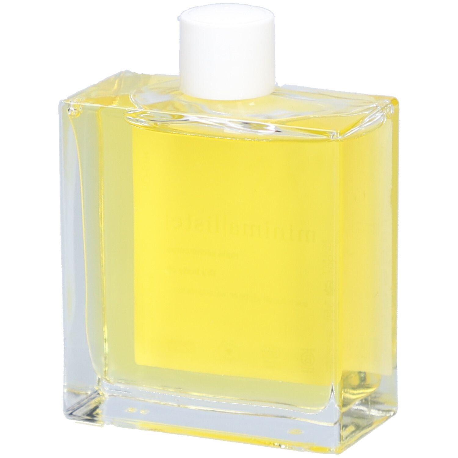 Glazen fles met gele olie en witte dop. Etiket met productnaam en informatie. Close-up.