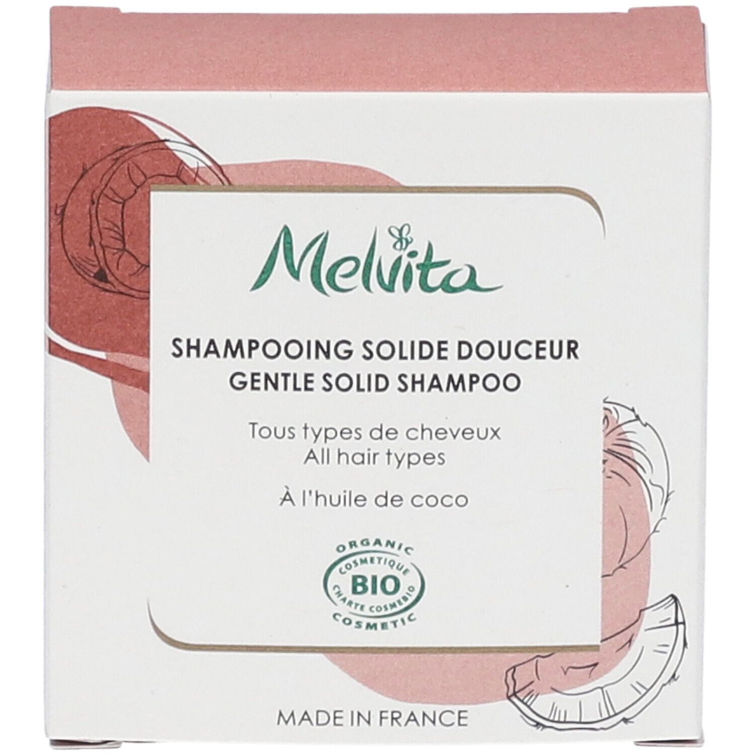 Vooraanzicht van de shampoo verpakking. Tekst: "Melvita", "Shampooing solide douceur", "BIO COSMETIC". Kokosnoot illustratie.