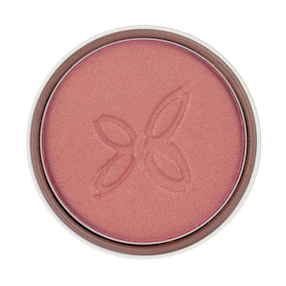 Fard à paupières rose dans un boîtier rond. Logo en relief. Bord blanc.